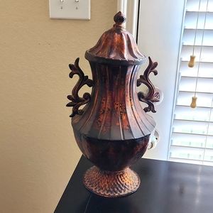 Decorate metal urn with lid